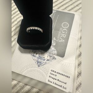 Moissanite eternity ring- size 7.5.  3mm, 1 carat, set in sterling silver.